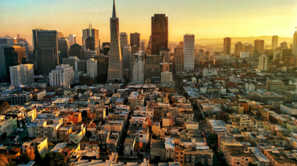 High Angle View Of Modern Cityscape During Sunset