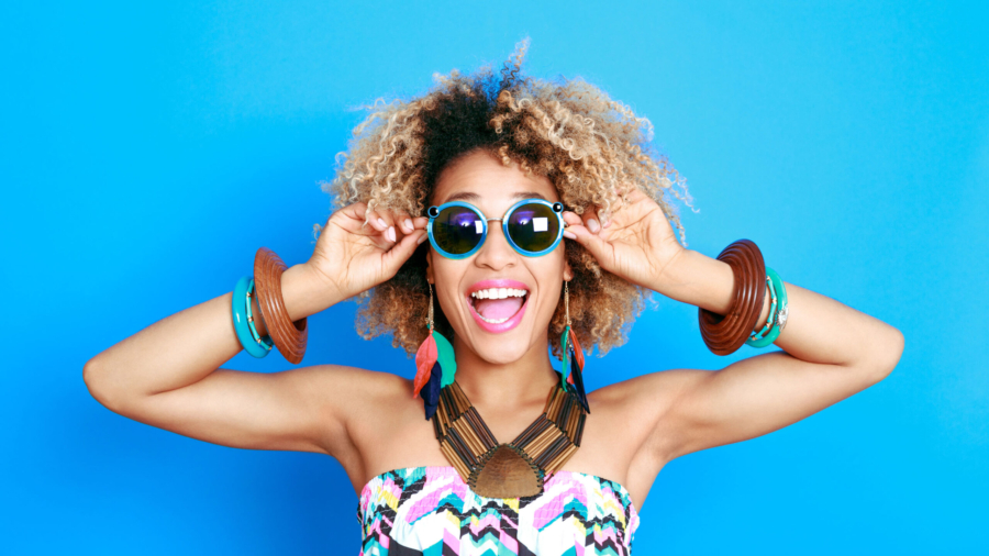 Summer portrait of excited afro american young woman