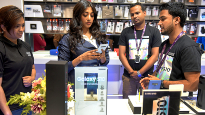 Samsung showroom demonstrator seen showing the features of