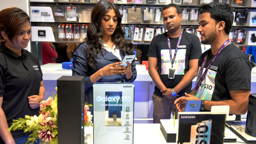 Samsung showroom demonstrator seen showing the features of